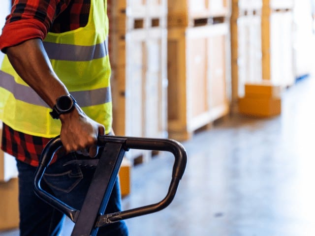 Warehouse operative moving goods in essex fulfilment warehouse